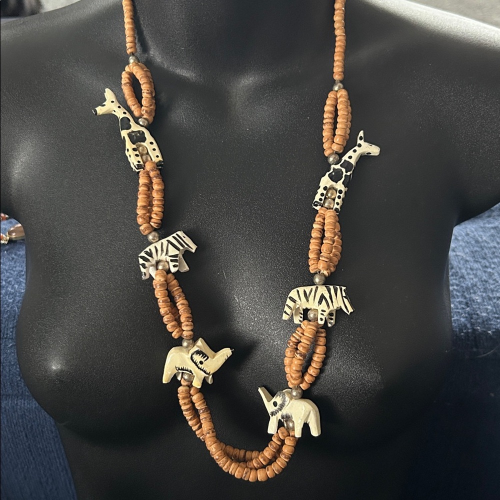 vintage artisan handmade necklace features carved wooden animal pendants